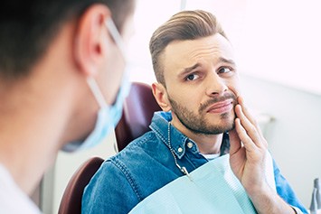 A man seeing his dentist for gum disease treatment