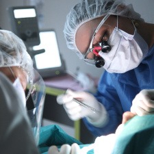 Dentist performing surgery