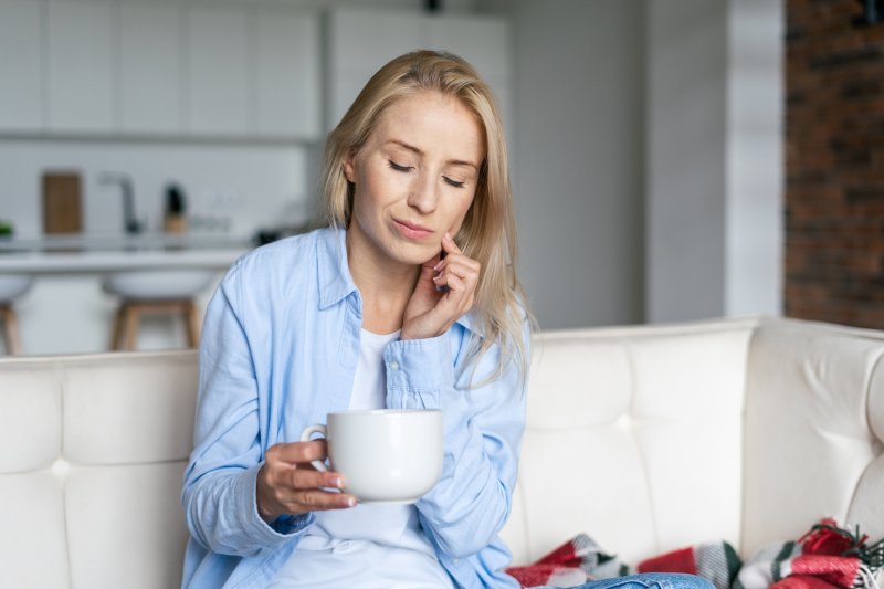 Woman with dental implant sensitivity